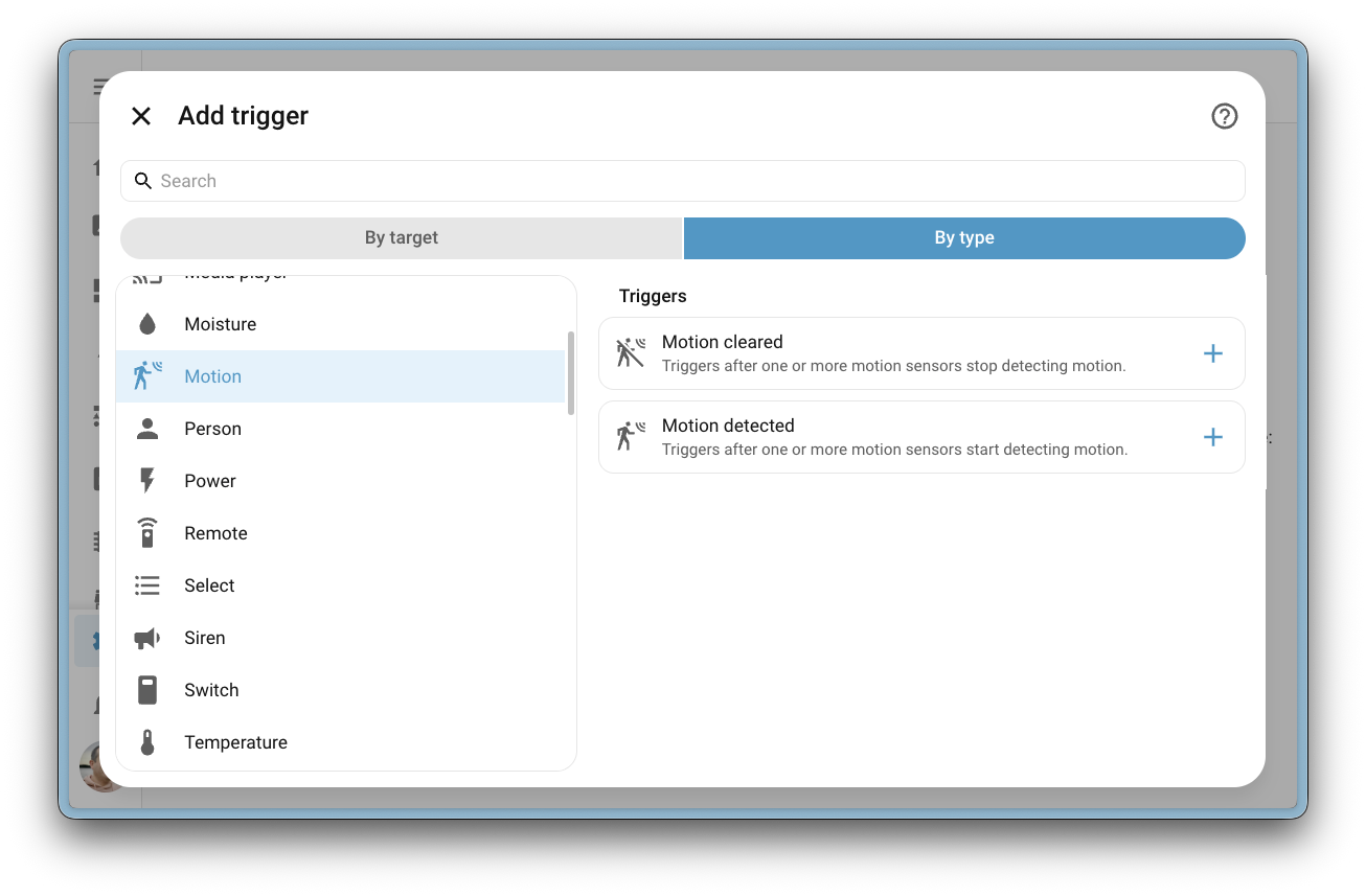 Screenshot of the Add trigger dialog in the automation editor, showing the new cross-domain trigger categories like Humidity, Illuminance, Motion, Occupancy, and Power. The Motion category is selected, revealing Motion cleared and Motion detected triggers.